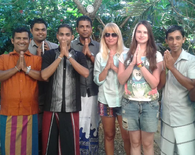 Guests and guides greeting together with folded hands